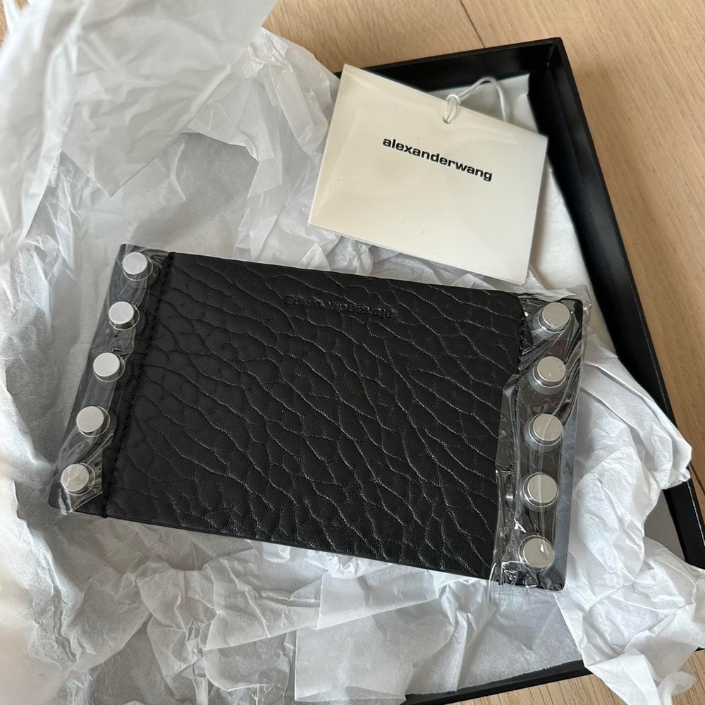 Alexander Wang Trap Stud Candle Sleeve 
Black lambskin leather sleeve